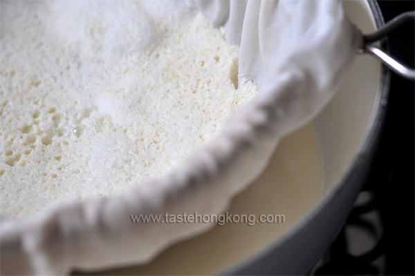 Draping a Cheese Cloth Across a Colander for Filtering Soy Milk