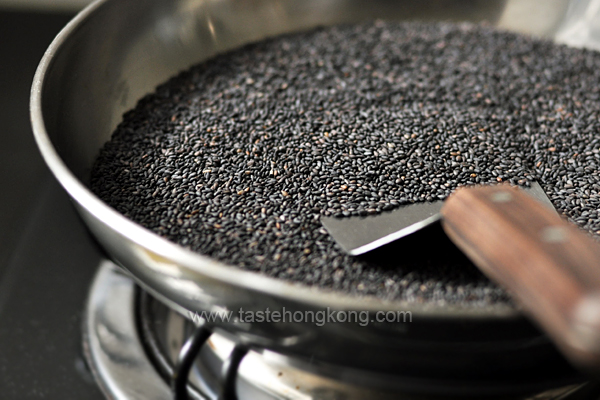 Fried Black Sesame Seeds in White Wok